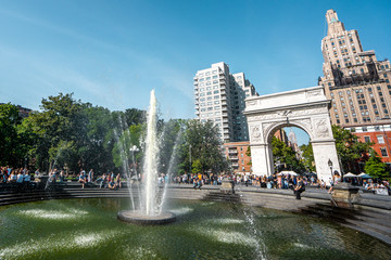 A sunny day in Washington square park during afternoon in Manhattan , New york city
