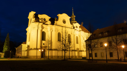 Fototapeta na wymiar Night view of Brevnov monatery in Prague, Czech Republic. Benedictine Archabbey of St Adalbert and St Margaret was founded in 993 AD