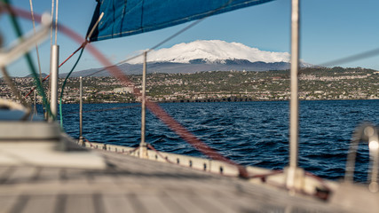 Sicily, Catania. View of the volcano Etna from a sailing boat