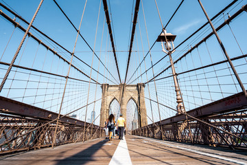 Walking on Brooklyn bridge in Manhattan , New york city
