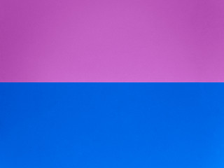 Two trendy colored papers arranged in parallel top view. Pink and blue paper texture abstract background with copy space for your design. Can be used for greeting cards, banners.