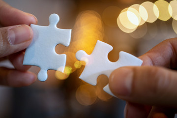 team hand power full  hand placing the  jigsaw puzzle piece for conect business partner and connection start up new project concept worker  unity team, Digital Nomad joint team partner