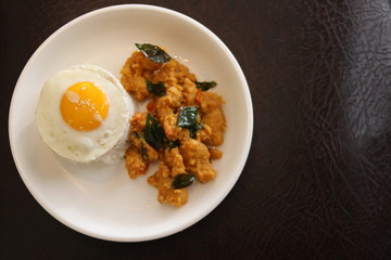 Crispy chicken rice served with sunny side up egg