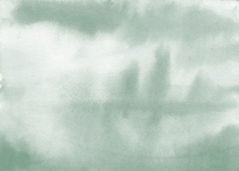 Watercolour green background with natural paper texture, hand-painted watercolor degrade splashes and Iceberg Green Color. Artistic design element with magic forest, landscape silhouette and mist.