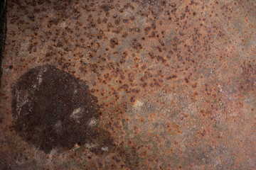 Old orange rusty piece of metal
