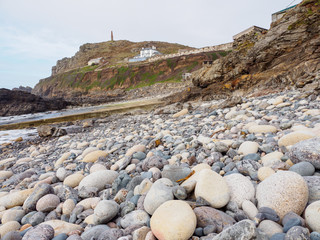 Wide view of the pebble beach along Priest's Cove, site of the annual Brisons iselet swimming competion. Cornwall, United Kingdom. Travel and nature. - 312219702