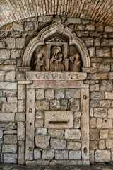 Wall sculpture of main gate in Kotor old town, Montenegro