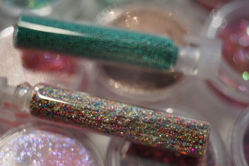 Set of various materials for the design of nails in glass tubes, nail art rhinestones.