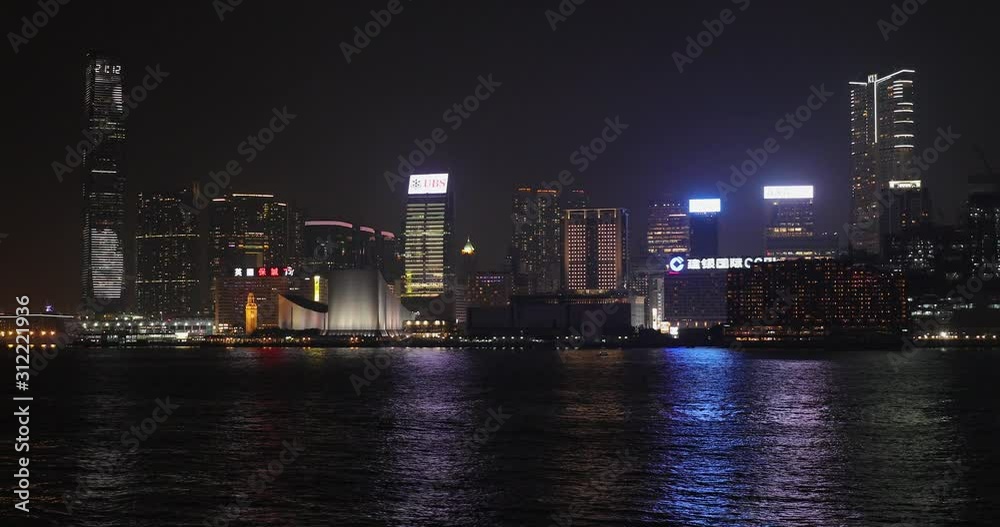 Wall mural kowloon tsim sha tsui side of victoria harbour at night in hong kong china