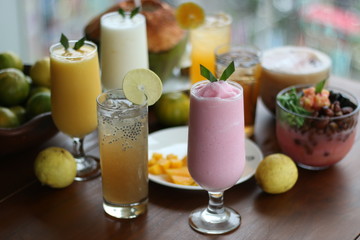 Fresh Juice Orange, Juice Strawberry with blurred background