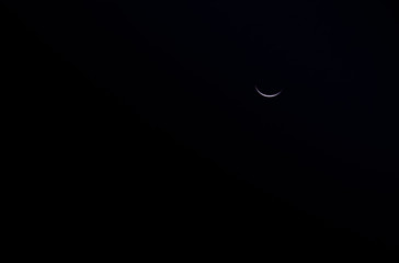 Crescent moon on a dark night