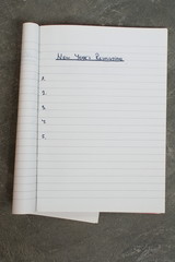 list of new year's resolutions in a notebook