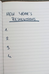 list of new year's resolutions in a notebook