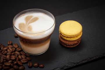 Coffee cappuccino and coffee beans on black background