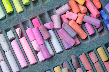 Chalk sticks various colors in a box close up, colorful chalk pastel for preschool children, kid...