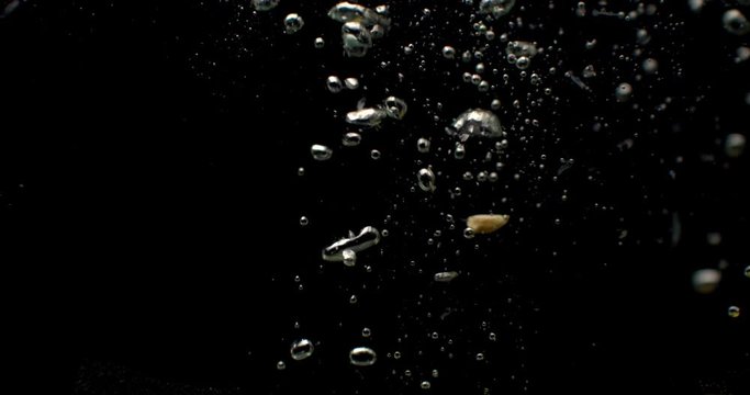 Super Slow Motion Shot of Falling Lemon into Water 
