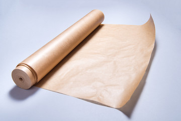 Roll of baking paper on grey background