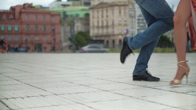 Close up shot of two dance partners feet while doing a professional tango routine in Downtown Buenos Aires