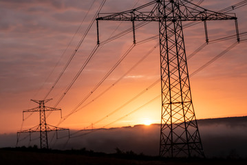 high voltage post,High voltage tower sky surise background