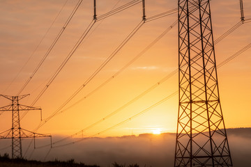Fototapeta premium high voltage post,High voltage tower sky surise background