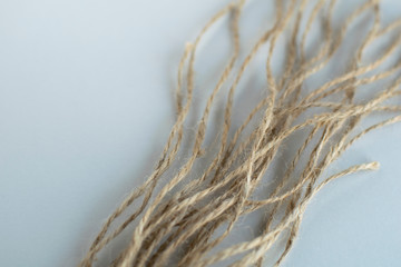 Close up jute thread at gray background. Eco-friendly materials.