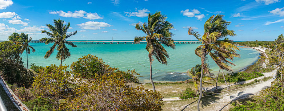 Panoramic picture of highway bridge and Calusa Beach on Florida keys in spring during daytime
