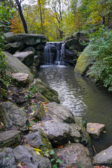 Fototapeta na wymiar New York, NY, USA: A waterfall near the North Woods section of Central Park.