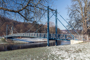 Fototapeta premium small bridge over a river in winter
