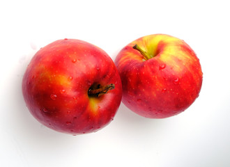 two red apples on a white background