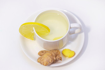 ginger tea with lemon and honey. Tea for immunity, a cold drink. ginger tea in a white cup on a white background. The concept of winter, health, immunity. A healthy detox drink.