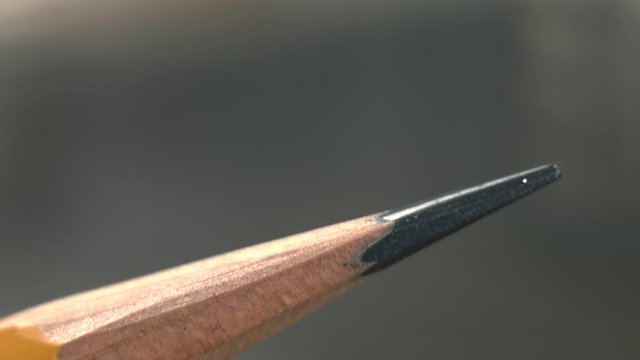 sharpening a pencil with a chisel close-up