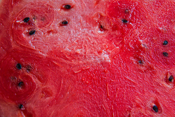 Juicy red pulp of watermelon, beautiful fruit background. Sweet berry. The concept of healthy eating. horizontally. Close up
