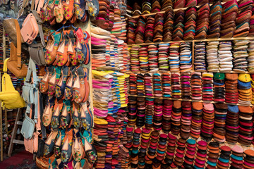 The traditional handmade leather handbag and slippers and other product is displayed in the tannery and showroom in the souk of Fes. Morocco