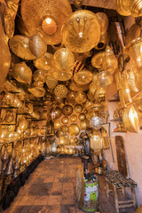 Fototapeta na wymiar Moroccan style hanging lamps at the market in medina. Lamps and souvenir shops, Marrakech. Traditional moroccan market, Morocco in Africa. Store in Marrakech or Fes taken in December 2019 Nice gift