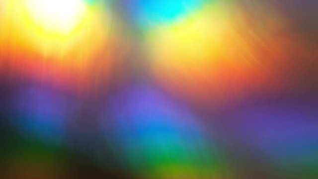 Rainbow abstract glowing light colorful defocused background. Slow motion