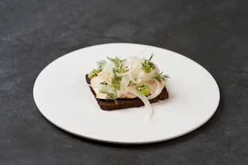 Smorrebrod with fried chicken, fennel and tarragon. Toasted bred with chicken