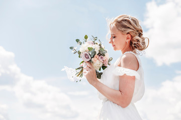 bride with bouquet of flowers