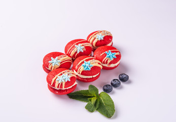  red macaroons on a white background for the site