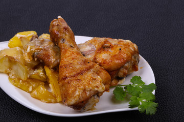 Roasted chicken legs with potato