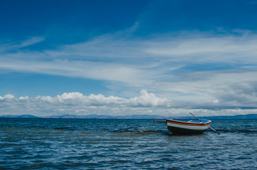 Naklejka na ściany i meble boat in the calm sea