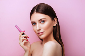 Beautiful young woman with colorful lipstick izolated on pink background