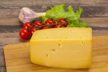 Hard yellow tasty cheese brick