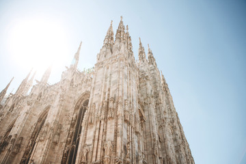 Obraz premium Beautiful view of the ancient Duomo Cathedral in Milan in Italy. It is one of the most popular tourist attractions in Italy.