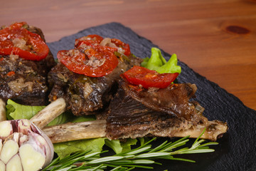 Baked elk meat with tomatoes