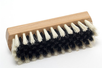 Clothes brush  with wooden handle isolated on white background