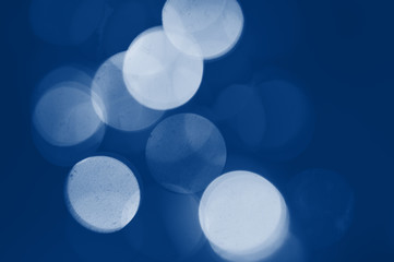 Classic blue toning trend 2020 color. Beautiful bokeh for web or design background with place for your text