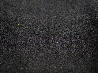 The texture of brilliant black foam with glitter and metallic effect for creative promo background