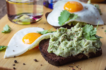 Brunch on Valentine's Day,  avocado toasts with fried egg