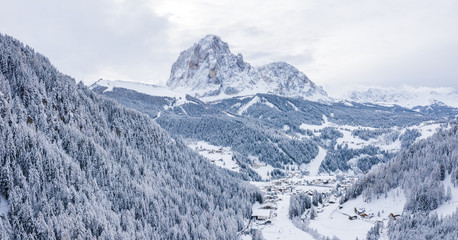 Panoramic view of beautiful winter wonderland mountain scenery in the Alps near Dolomites. 