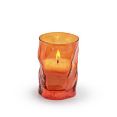 Candle in a decorative colored glass. Isolated on white background